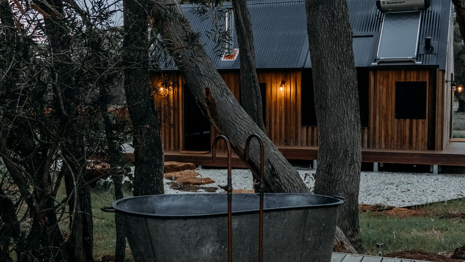 An outdoor bath tub in a quiet countryside garden